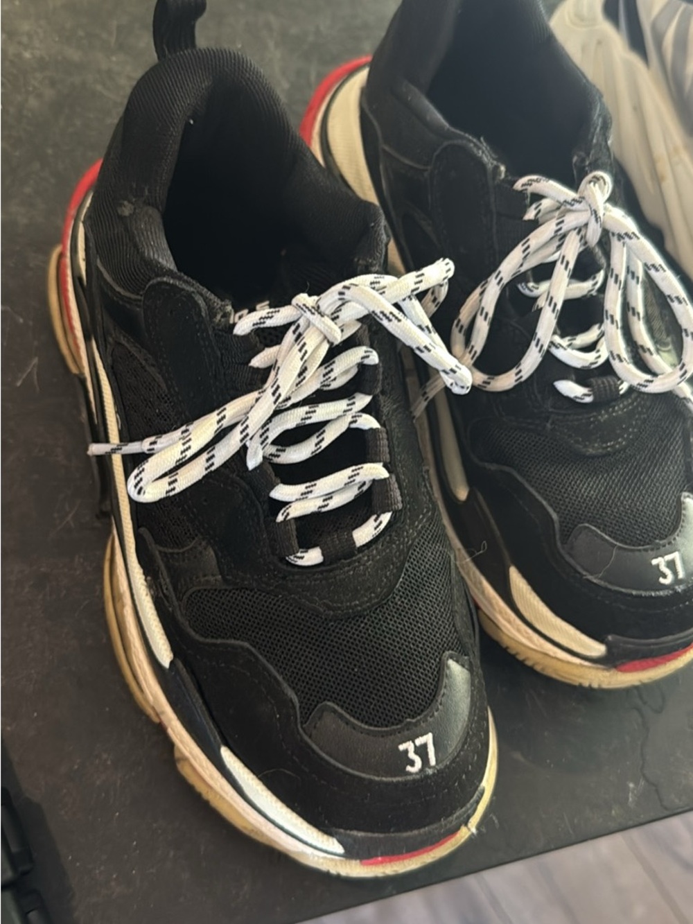 Balenciaga Black Chunky Triple S Sneakers with White Laces and Red Sole Accents